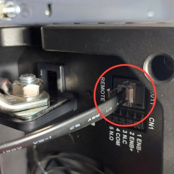 <p>Plug data cable into remote socket on back of inverter.</p>