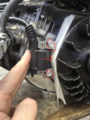 <p>Refit coil using 10mm bolts leave loose. Fit piece of paper that you put aside earlier between the coil and the flywheel. Lightly press on coil applying the light pressure towards the flywheel and tighten 10mm bolts. Remove paper once bolts are tightened.</p>
