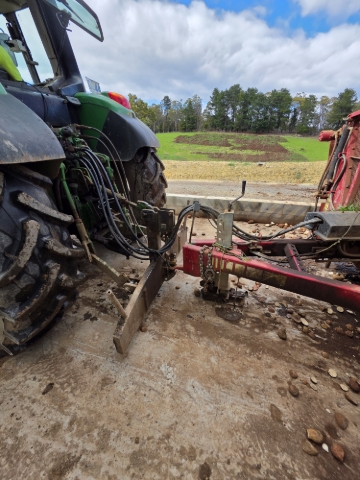 <p>Return the rear hitch and the front end loader to the ground</p>