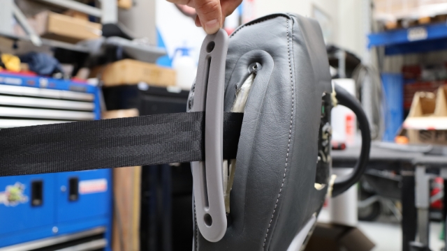 <p>Slide the seatbelt guide down the belt.</p>