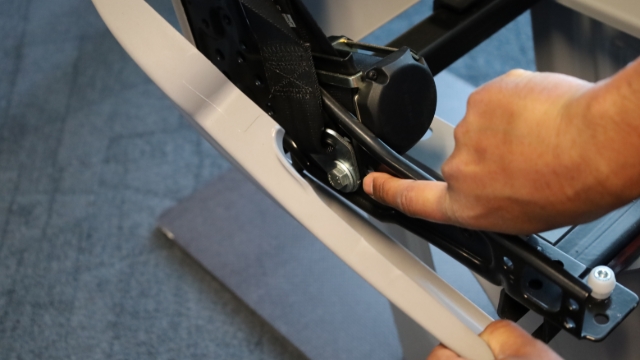 <p>With the side seat cover removed you will be able to access the bolt that attaches the retractor reel.</p>