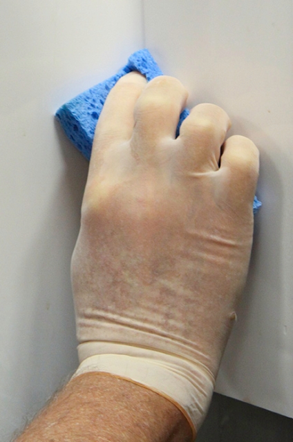 <p>Clean scale deposits from the surface areas of the ice machine. Use a clean towel or sponge soaked in cleaner/descaler solution to wipe the ice machine surfaces, including the side walls, the base (area above the water trough), and the bin or dispenser.</p>