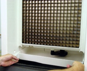 <p>Remove the water trough. Depress the tabs on the right and left sides of the trough. Allow the front of the trough to drop as you pull forward to disengage the rear pins.

Ice damper (where fitted): press the damper to the left and flex the middle. Pull forward on the right side until the right damper pin is free, then slide the left pin out.</p>