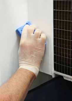 <p>Sanitize the surface areas of the ice machine. Use a clean sanitizer-soaked towel on the ice machine surfaces, including the side walls, the base (area above the water trough), and the bin or dispenser. Spray the surfaces with sanitizer solution and wipe down.

Manitowoc sanitizer is classified as a no-rinse sanitizer — do not rinse sanitized surfaces.</p>