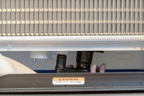 <p>Remove the water pump. Grasp the pump and pull straight down on the pump assembly until it disengages and the electrical connector is visible. Disconnect the electrical connector, then remove the water pump assembly from the ice machine.</p>