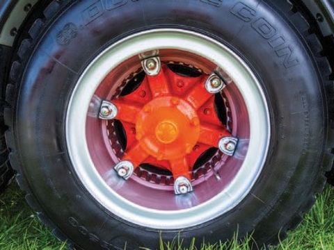 <p><strong>Dayton Style Rims</strong></p><p>The name Dayton refers to the brand that popularized rims that used this wedge wheel nut system. </p><p>Dayton style wheel assemblies have the spokes on the hub rather than in the rim. </p><p>To fix the rim to the hub, Dayton style assemblies use a wedge that is forced in between the rim and the spokes by a wheel nut. </p><p>⚠️Important:</p><p>The wedges have had a lot of force driving them in, to fix the wheel tightly. This means that they exploded outwards when the rim is released. To safely handle this, only release all the wheel nuts a little bit, and then tap the wedges with a hammer. They will pop out with a bang, and will be caught by the wheel nuts. You can then take the wheel nuts and wedges completely off and remove the wheel. </p>