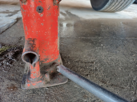 <p><strong>Letting Down the Jack</strong></p><p>When letting down the jack, make sure you are in a position that is low enough so that you wont get crushed.</p><p>When ready, slowly release the valve to let the jack down.</p><blockquote><p>Always keep the spanner on the valve until the jack has completely lowered. this is so that if something starts to go wrong you are able to stop it very quickly.</p></blockquote><p></p>