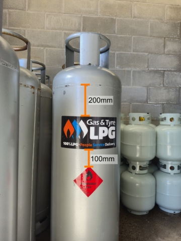 <p><strong>45kg Gas Bottle</strong></p><ul><li><p>Gas &amp; Tyre sticker goes opposite the valve (when cylinder is connected, sticker is facing outwards)</p></li><li><p>Place 200mm below top weld line, centered and straight</p></li><li><p>Red diamond goes 100mm below Gas &amp; Tyre sticker</p></li></ul><p></p>