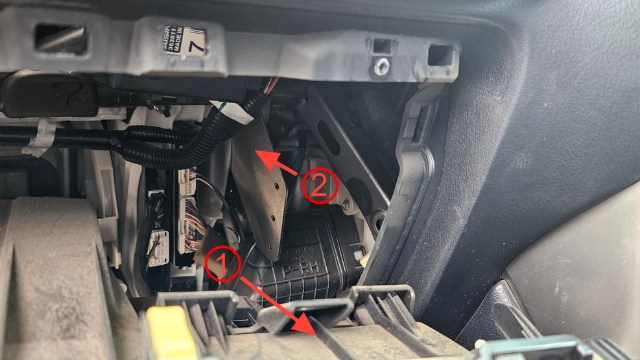 <p>Step 4: Pop the rear panel (1) out partially and flex it forward to gain access to the cavity.</p><p>Pictured is the mounting location of the bracket (2).</p><p></p>