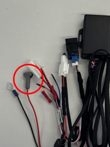 <p><strong>Step 4: </strong>Locate the crimp connector on the main harness (circled)</p>