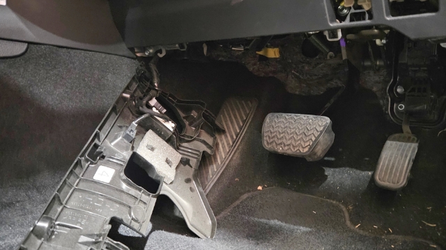 <p>10.</p><p>From the passenger side, feed the switch
portion of the harness behind centre dash
and through to drivers side
(There is hollow for the harness to pass
through as indicated).</p>