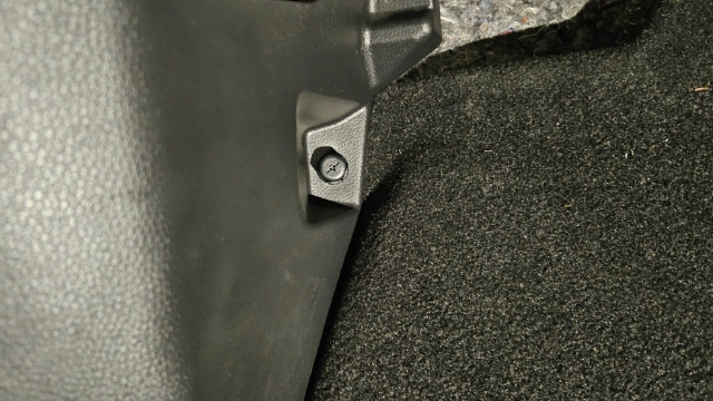 <p>3.</p><p>Unscrew the plastic nut and remove the
kick panel.</p>