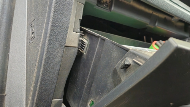 <p><strong>Step 1:</strong> Remove glove box by squeezing in the tabs on each side and pulling forwards.</p>