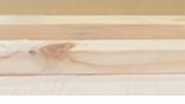 <p>The bearers are removed and a double sided tape is applied to one side of each bearer. These are then placed to the side of the packet.</p>