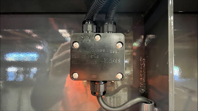 <p>Screw the junction box cover in place.</p>