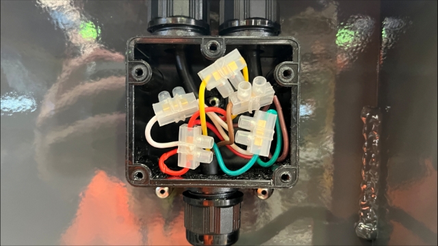 <p>Feed the cables into the junction box and join the Tractor cable to the light cables using connector blocks.</p><p><br>Join Wires based on their color.</p>