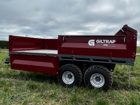 <p>Reattach the posts and sides of the tip trailer</p>