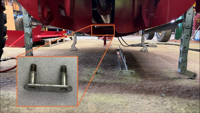 <p><span>While standing at the rear of the unit,
reach under the boom assembly and pull out the rear joiner link.</span><br></p>