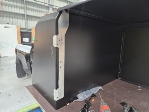 <p>IF HOLES ARE MISSING USE JIG TO DRILL HOLES. THESE HOLES SHOULD ALREADY BE DRILLED IN FABRICATION BEFORE PC&nbsp;</p><p></p><p>Mark and drill the hinge holes in the back of the toolbox using the jig.</p>