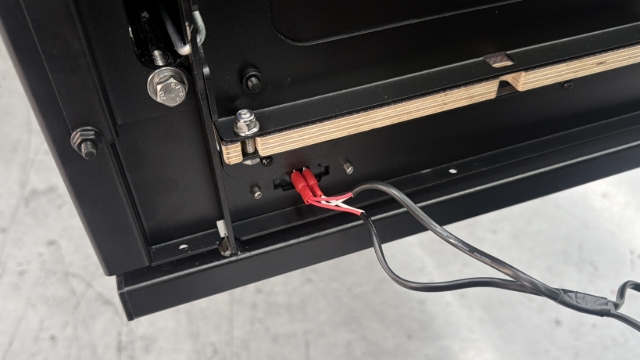 <p>Plug the female blade terminals of the number plate lights on the faceplate into male terminals on the backing plate.</p>