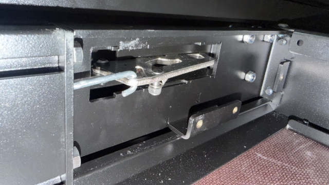 <p>Hook the rod into the catch.</p>