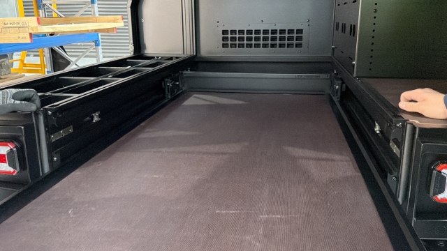 <p>Slide the drawer into the body.</p><p><em>Note: Manually unlatch to slide the drawer past the first set of catches.</em></p>