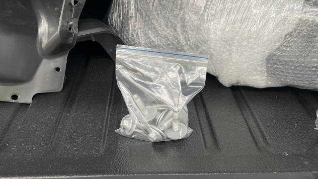 <p>Put the chassis mounting bolts in a plastic bag and place in the tub.</p>