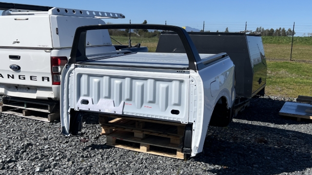 <p>Using a forklift, put the tub in the yard.</p>