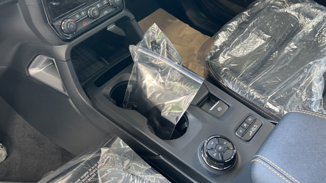 <p>Unplug the camera and store in a plastic bag in the centre console of the cab.</p>