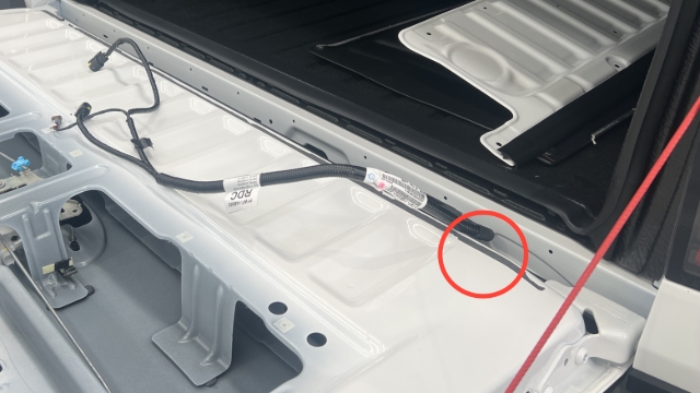 <p>Remove the wiring harness from the tailgate through the exit point on the RHS.</p>