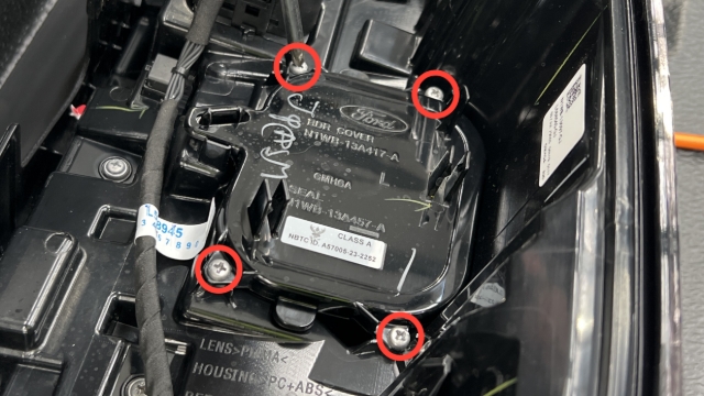 <p>Remove the blind spot sensor using a Phillips screwdriver.</p>