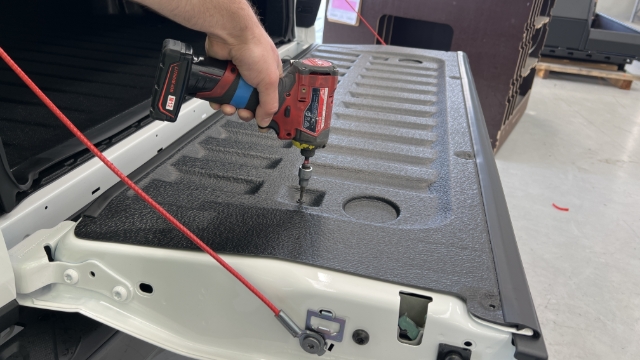 <p>Remove the tailgate liner using a T20 torx screwdriver.</p>