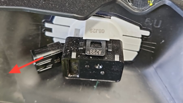 <p>Remove reverse sensor connectors </p><blockquote><p><strong>CQC:</strong> Use extreme caution with removal</p></blockquote><p><em>Use pry tool or flat screw driver to help depress connector </em></p>