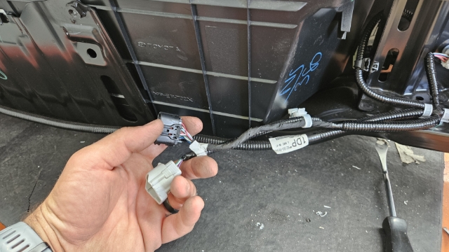 <p>Disconnect electrical connectors from harness from underneath bumper </p>