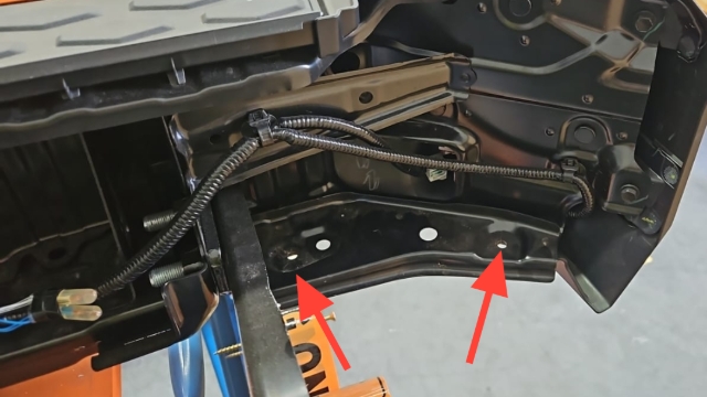 <p>Place bumper onto work bench</p><p>Remove plastic lower clips with flat head screw driver </p>