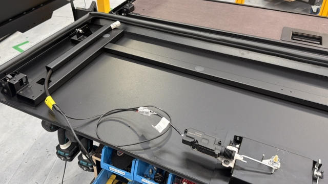 <p>Side Doors: Run the door wiring loom away from the handle, through the wiring cover.</p><p>Rear Door: Run the door wiring loom across the handle, through the wiring cover.</p><p>Tie up any loose wiring so it does not interfere with the door mechanism.</p>