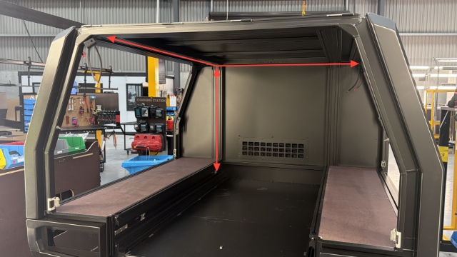 <p>Route the body wiring harness through the wiring channels in the directions shown - the branch with 2 plugs needs to be routed to the rear of the body.</p>
