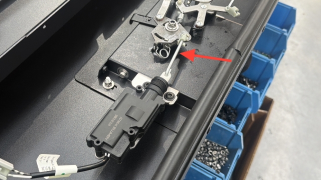 <p>Install the locking arm between the actuator and handle.</p>