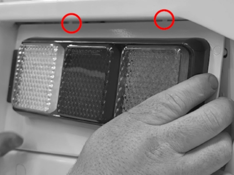 <p>Angle in the taillight plate to the rear bumper. The notches in the plate should slot up into the bumper first, then press the studs in through the holes.<br></p>
