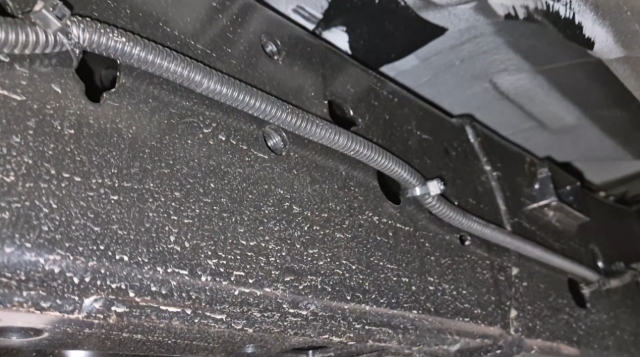 <p>Continue routing along the inside of the chassis to the front of the vehicle. </p>