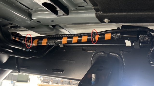 <p>Continue to follow OEM harnesses under the cab towards the engine bay.</p><blockquote><p><strong>CQC: Ensure wiring is routed clear of hot vehicle components.</strong></p></blockquote><p></p>
