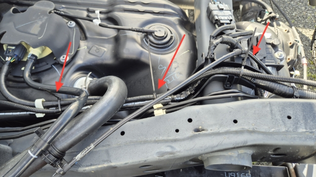 <p>Secure to the plastic housing and route under the diff breather and fuel lines, following the factory harness towards the engine bay. </p>