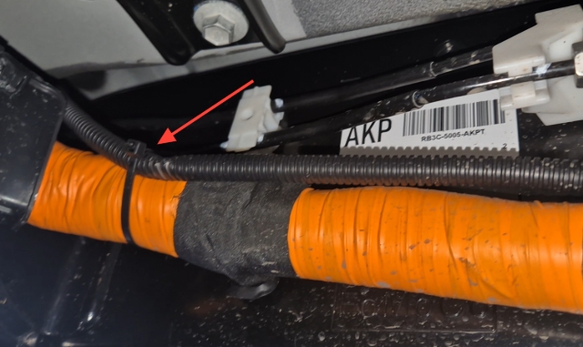 <p>Feed the wiring through to the engine bay.</p><p>Using a hook or a guide wire and some tape, feed the wire up from underneath into the engine bay ensuring no contact with vehicle brake or fuel lines.</p>
