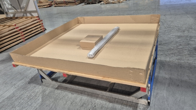<p>Place fitting kit and any other accessories to go with the canopy in the center of the box and tape down using clear packing tape.</p>