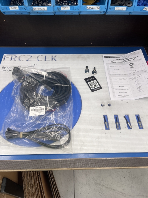 Fitting Kit on Poke-Yoke board, despatch list ticked off, warranty tag on key