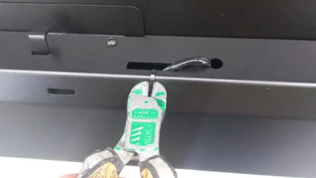 <p>Cut the cable tie holding wire to central lock cover</p>