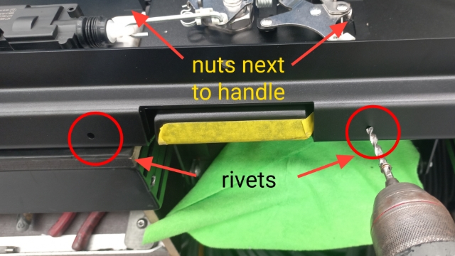 <p>Drill out the two rivets holding the bottom edge of handle assembly and remove the two 10mm nuts either side of the handle assembly </p>
