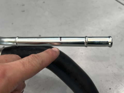 <p>Cut approximately 60mm from the factory breather line to use as a joiner.</p><p>After cutting, remove any sharp edges from cut and any swarf or metal filings from inside pipe<br></p>