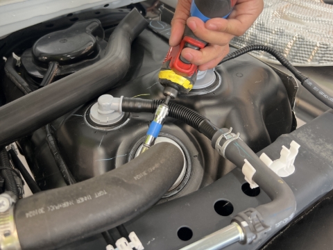 <p>Loosen the hose clamp at the tank-end of the main fuel line using a 10mm socket.<br></p>