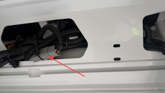 <p>Re-secure wiring loom with cable ties and plug the 6 pin deutsch connector</p>